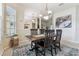 Bright dining room with a view of the foyer and living spaces at 10306 Shalimar Wood Dr, Thonotosassa, FL 33592