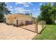 A charming home with a brick driveway, a two-car garage, and a fenced yard at 10306 Shalimar Wood Dr, Thonotosassa, FL 33592
