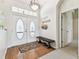 Bright foyer featuring a double front door with transom window, and coat rack at 10306 Shalimar Wood Dr, Thonotosassa, FL 33592