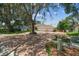 Charming single-story home with a three-car garage, landscaped yard, and long brick driveway at 10306 Shalimar Wood Dr, Thonotosassa, FL 33592
