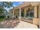 Cozy front porch with chairs, flower baskets, and a charming outdoor space at 10306 Shalimar Wood Dr, Thonotosassa, FL 33592