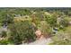 A beautiful front yard with mature trees and a brick driveway, providing great curb appeal at 10306 Shalimar Wood Dr, Thonotosassa, FL 33592