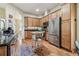 Inviting kitchen with wood cabinets, stainless steel appliances, and hardwood floors at 10306 Shalimar Wood Dr, Thonotosassa, FL 33592