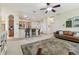Cozy living room seamlessly connected to the kitchen area with breakfast bar seating at 10306 Shalimar Wood Dr, Thonotosassa, FL 33592
