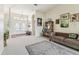 Open concept living room and entry foyer, with a sofa and French doors at 10306 Shalimar Wood Dr, Thonotosassa, FL 33592