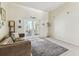 Bright living room with French doors leading to a patio area at 10306 Shalimar Wood Dr, Thonotosassa, FL 33592
