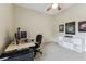 Bright office space featuring a desk, computer, and storage unit, ideal for remote work or study at 10306 Shalimar Wood Dr, Thonotosassa, FL 33592