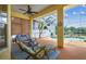 Relaxing screened-in lanai with comfortable seating and a beautiful view of the sparkling pool at 10306 Shalimar Wood Dr, Thonotosassa, FL 33592