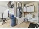 Functional utility room featuring essential systems and storage, ensuring seamless home maintenance at 10306 Shalimar Wood Dr, Thonotosassa, FL 33592