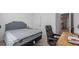 Comfortable bedroom featuring a plush bed, workspace, and neutral decor at 10448 Ladybug Cv, Parrish, FL 34219