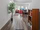 Open floor plan showing the entry hall, living room, and dining area with cohesive decor at 10448 Ladybug Cv, Parrish, FL 34219