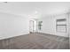 Spacious carpeted bedroom with natural light from two windows offering a bright and airy feel at 11199 Murraysville Dr, Spring Hill, FL 34609