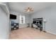 This bedroom provides neutral-colored carpet, a ceiling fan, and a light blue painted wall at 11206 Coventry Grove Cir, Lithia, FL 33547