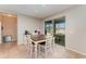 Bright breakfast nook with a table, chairs, and sliding glass doors overlooking the outdoor patio and pool at 11206 Coventry Grove Cir, Lithia, FL 33547