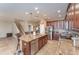 Spacious open kitchen with granite countertops, a large island, stainless steel appliances, and access to living area at 11206 Coventry Grove Cir, Lithia, FL 33547