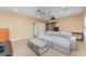 This living room provides a projector with a projector screen and windows for natural light at 11206 Coventry Grove Cir, Lithia, FL 33547