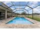 Backyard featuring a screened in pool, patio, hot tub, and fence at 11206 Coventry Grove Cir, Lithia, FL 33547