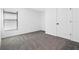 Cozy bedroom with carpet flooring, a window with blinds, and a closet door at 11300 Libby Rd, Spring Hill, FL 34609