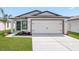Charming single Gathering home featuring a two-car garage and well-manicured lawn at 11300 Libby Rd, Spring Hill, FL 34609
