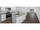Open concept kitchen with granite countertops and stainless steel appliances at 11300 Libby Rd, Spring Hill, FL 34609