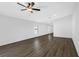Spacious living room with wood flooring, ceiling fan and natural light at 11300 Libby Rd, Spring Hill, FL 34609