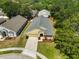An elevated perspective of the home, highlighting its roof and surrounding greenery at 11726 S Stone Ln, Riverview, FL 33569