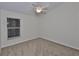 Bedroom with neutral walls, plush carpet, and a window providing natural light at 11726 S Stone Ln, Riverview, FL 33569
