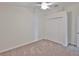 Bedroom with white walls, closet, ceiling fan and neutral carpet at 11726 S Stone Ln, Riverview, FL 33569