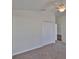 Comfortable bedroom with soft carpeting, ceiling fan, and spacious closet, providing ample storage and style at 11726 S Stone Ln, Riverview, FL 33569
