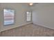 Bedroom with neutral walls, plush carpet, ceiling fan, and a window providing natural light at 11726 S Stone Ln, Riverview, FL 33569