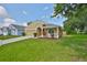Charming single-story home featuring a well-manicured lawn and a cozy front porch at 11726 S Stone Ln, Riverview, FL 33569