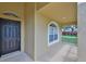 Inviting front porch with a charming window, stylish front door, and a cozy, welcoming entrance at 11726 S Stone Ln, Riverview, FL 33569