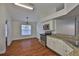 Charming kitchen with stainless appliances, granite countertops, and dining nook flooded with natural light at 11726 S Stone Ln, Riverview, FL 33569