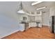 Bright kitchen with stainless steel appliances and granite countertops, offering style and functionality at 11726 S Stone Ln, Riverview, FL 33569