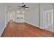 Open-concept living room with hardwood floors that connects to other parts of the house at 11726 S Stone Ln, Riverview, FL 33569