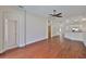 Spacious living room features hardwood floors, ceiling fan, and natural light at 11726 S Stone Ln, Riverview, FL 33569