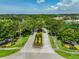 A street view shows meticulously maintained landscaping at the community entrance at 11726 S Stone Ln, Riverview, FL 33569