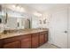 Bathroom featuring a dual vanity with granite countertops and modern fixtures at 11802 Twilight Darner Pl, Riverview, FL 33569