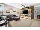 Comfortable living room featuring a ceiling fan, large sectional couch, and neutral colors at 11802 Twilight Darner Pl, Riverview, FL 33569