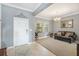 Cozy living room featuring neutral paint, tile floors, and comfortable seating arrangement at 11802 Twilight Darner Pl, Riverview, FL 33569