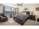 Serene main bedroom with a comfortable bed, neutral tones, and ample natural light at 11802 Twilight Darner Pl, Riverview, FL 33569