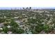 Aerial view of the property surrounded by lush greenery, with the city skyline and waterfront visible at 1211 14Th N St, St Petersburg, FL 33705