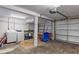 Spacious unfinished basement with exposed brick, laundry area, and an overhead garage door at 1211 14Th N St, St Petersburg, FL 33705