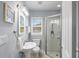 Bathroom with a pedestal sink, glass-enclosed shower, and classic fixtures at 1211 14Th N St, St Petersburg, FL 33705