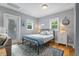 Inviting bedroom with ample natural light, a comfortable bed, and hardwood floors at 1211 14Th N St, St Petersburg, FL 33705