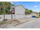 The home features a two-car garage, a fenced backyard, and a wooden deck on the second story at 1211 14Th N St, St Petersburg, FL 33705