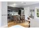 Modern kitchen with stainless steel appliances and bright lighting, and table for two at 1211 14Th N St, St Petersburg, FL 33705