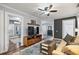 Cozy living room featuring hardwood floors, neutral walls, ceiling fan, and comfortable seating at 1211 14Th N St, St Petersburg, FL 33705