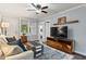 Comfortable living room with hardwood floors, a ceiling fan, and a large window for natural light at 1211 14Th N St, St Petersburg, FL 33705