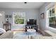 Bright living room with comfortable seating, large windows, and stylish décor at 1211 14Th N St, St Petersburg, FL 33705